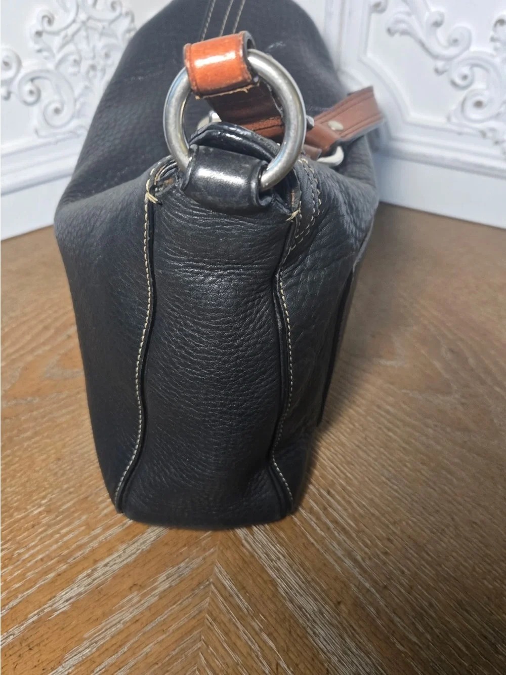 Coach Black Pebbled leather Chelsea turnlock top.